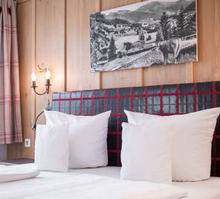 Doppelbett im Superiorzimmer im Hotel Adler Oberstaufen
